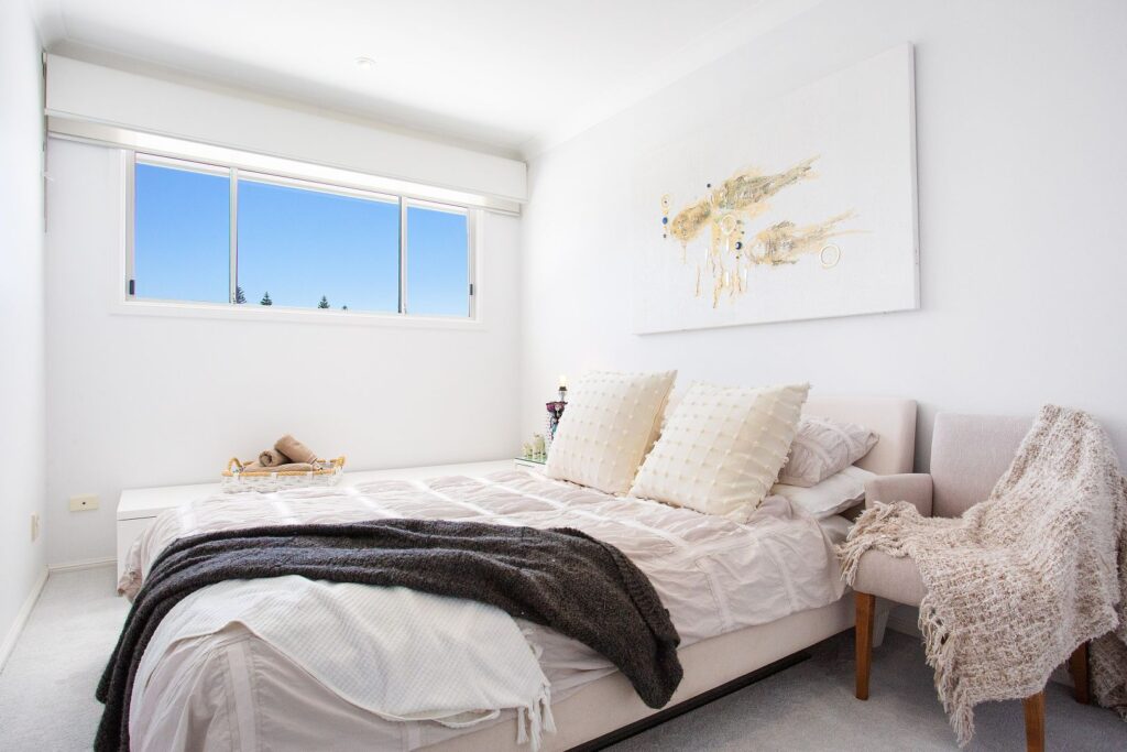 white sliding window in bedroom